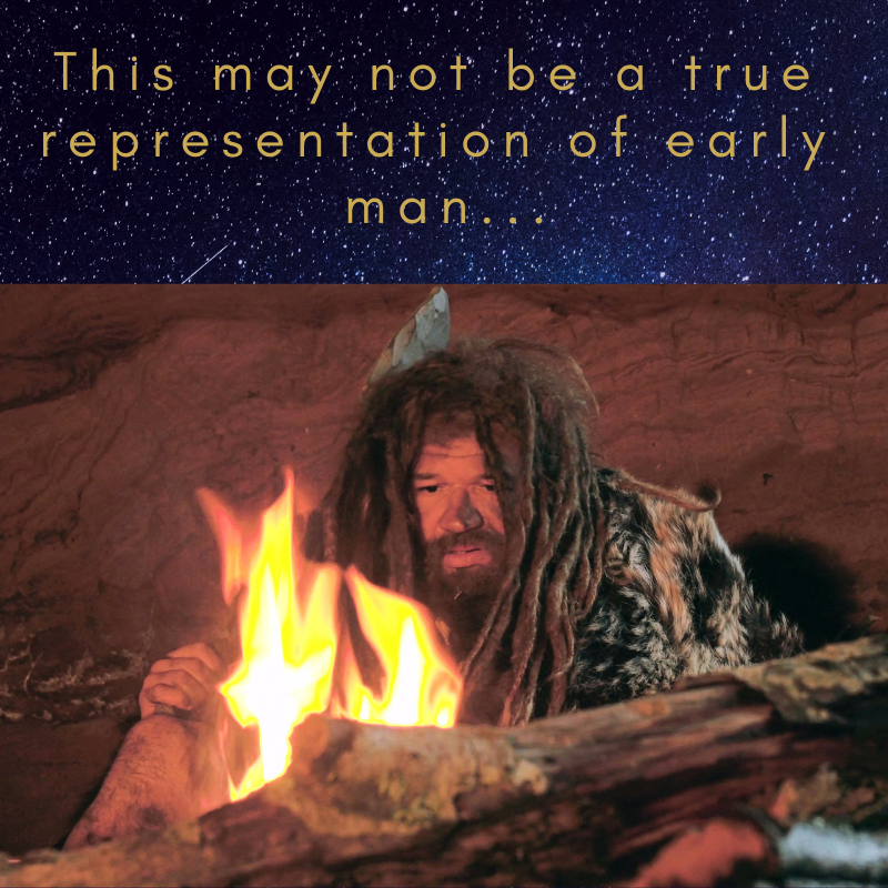 Image Description: A stereotypical caveman staring at a fire. Text reads: “This may not be a true representation of a caveman”